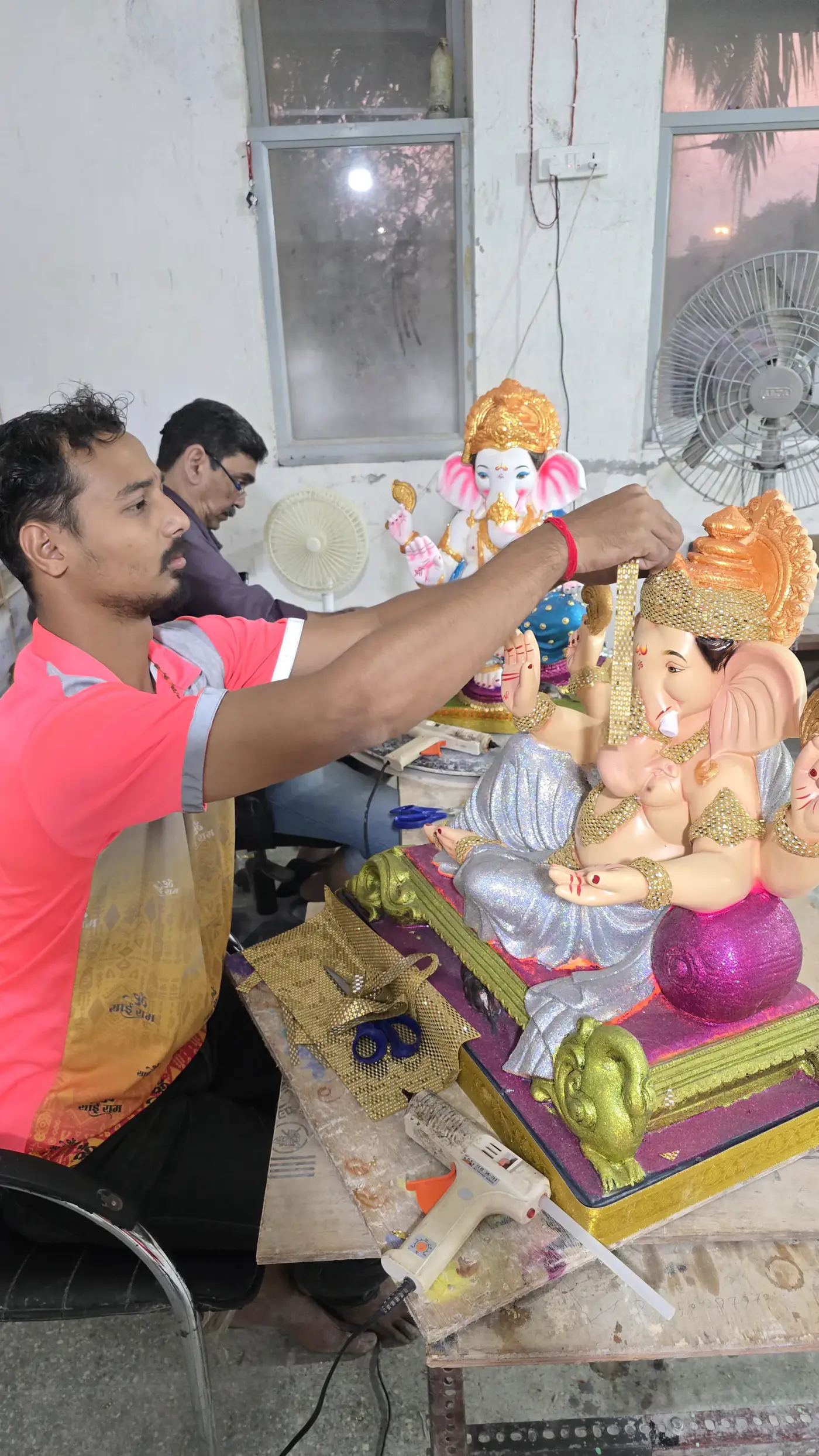 Plantable Tree Ganesha idol made of red soil with embedded seeds, hand-molded in the Devta workshop